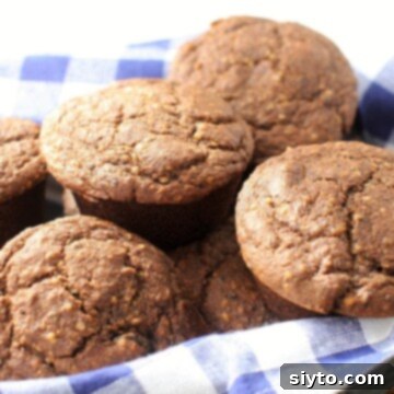 basket of gluten free bran muffins with blue checked napkin