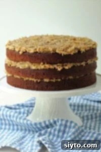 triple layer German chocolate cake on a white stand