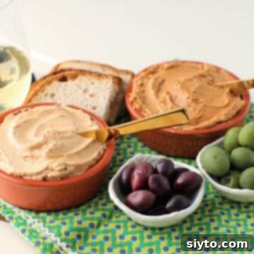 Delicious Tuna and Sardine Pâté served with olives and fresh bread, a perfect Portuguese appetizer