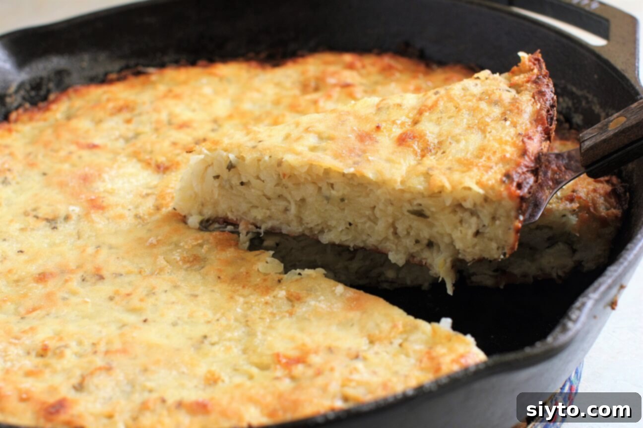 Bulgarian Patatnik Savoury Potato Pie 2 A skilled hand carefully lifting a golden-crusted wedge of Patatnik from the cast-iron skillet, revealing the tender, cheesy potato interior of the traditional Bulgarian pie.