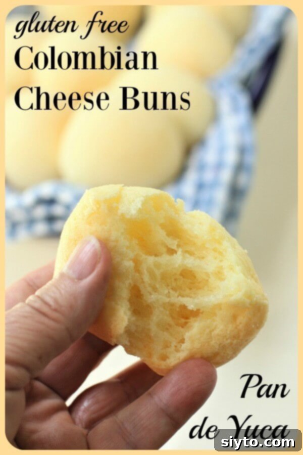 fantastic stretchy cheesy insides when you pull apart a pan de yuca cheese bun, highlighting its unique elastic texture