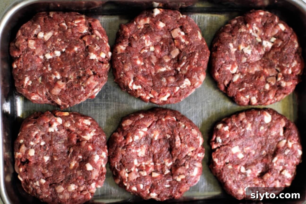 6 raw venison burgers ready for the grill