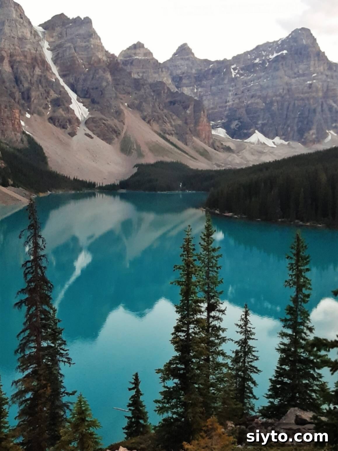 Banff's Best Bites Marinated Flank Steak and Mountain Views 25 The stunning turquoise waters of Moraine Lake, surrounded by majestic mountains in the early evening light of Banff National Park