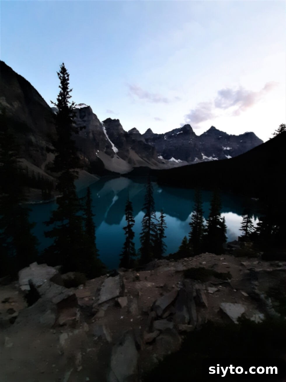 Banff's Best Bites Marinated Flank Steak and Mountain Views 26 Twilight descending on the still, turquoise waters of Moraine Lake, creating a magical, reflective mountain scene