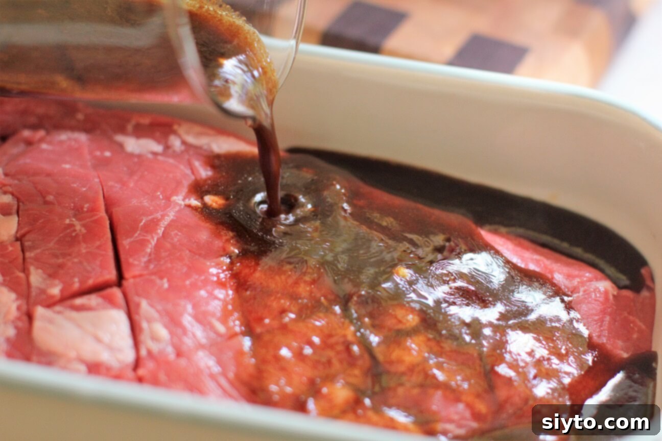 Banff's Best Bites Marinated Flank Steak and Mountain Views 4 Hand pouring a vibrant, zesty marinade over a flank steak in a plastic bag, ready for flavor infusion