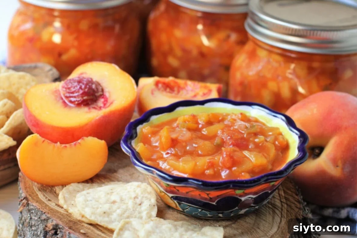 jars of canned peach salsa and a bowl of it in front of them