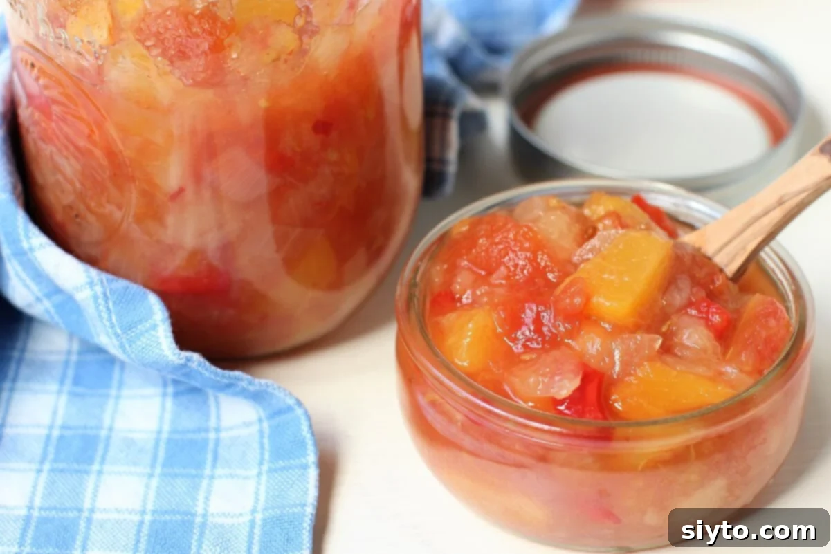 dish of Peach Pear Chutney next to pint of it