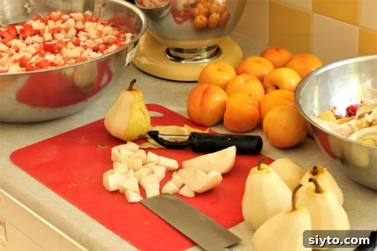 dicing the fruit, diced pears on a red cutting board