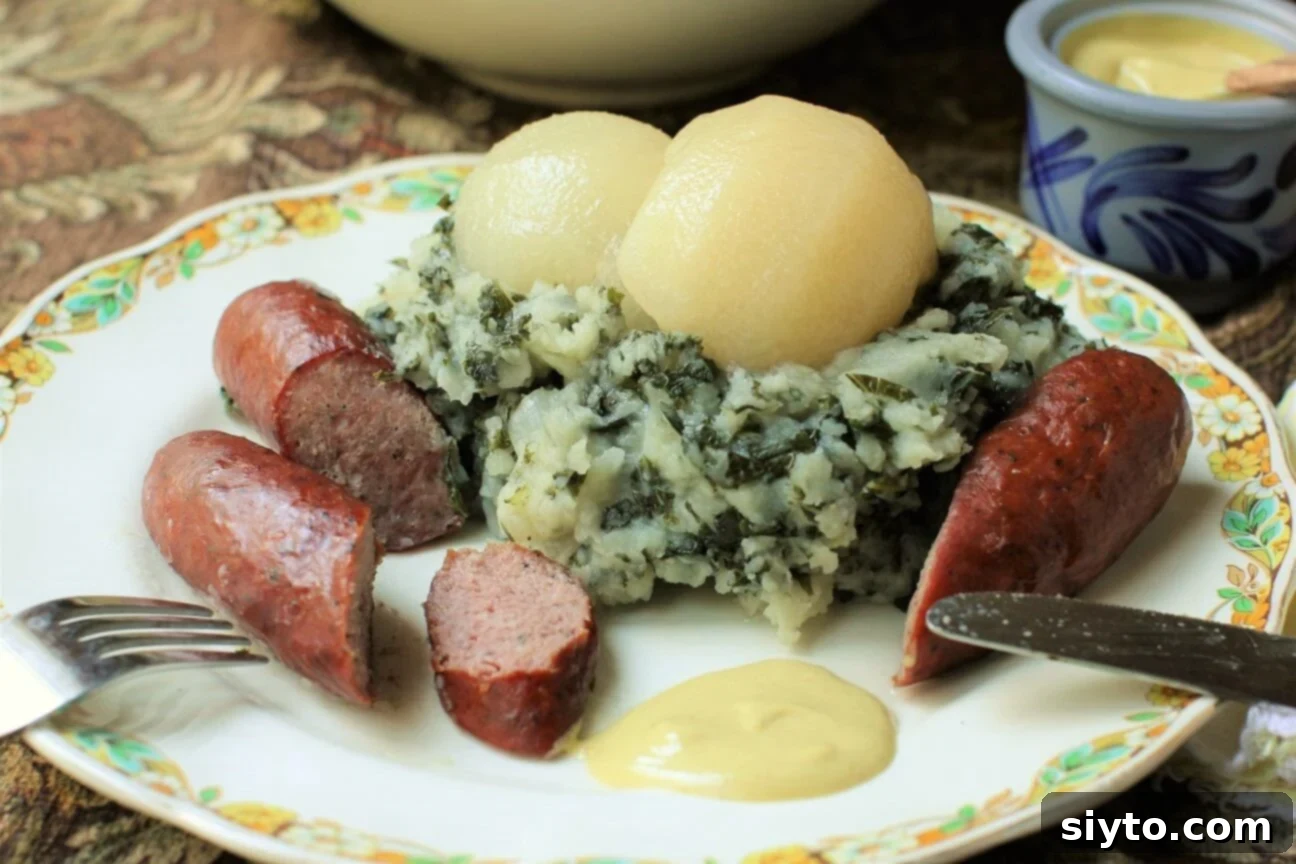 Boerenkool Stamppot The Heart of Dutch Comfort Food 5 A plate of Boerenkool Stamppot, partially eaten, showing the mixture of kale and potatoes with sausage and pear. The image highlights the inviting and homey nature of this traditional Dutch dish.