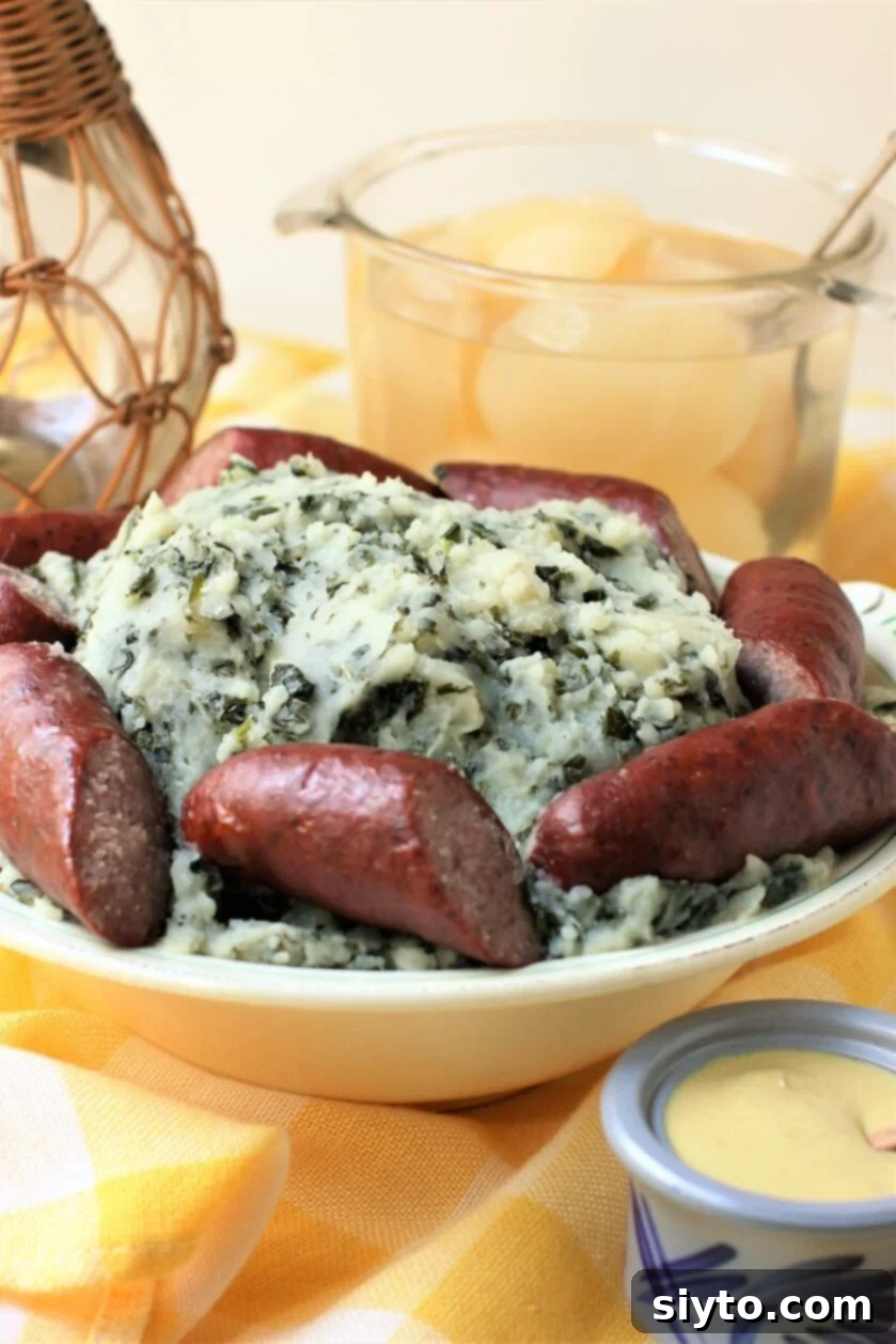 Boerenkool Stamppot The Heart of Dutch Comfort Food 6 A large serving dish filled with Boerenkool Stamppot, featuring the mashed kale and potatoes, set against a bright, inviting background, highlighting its appeal as a central family meal.