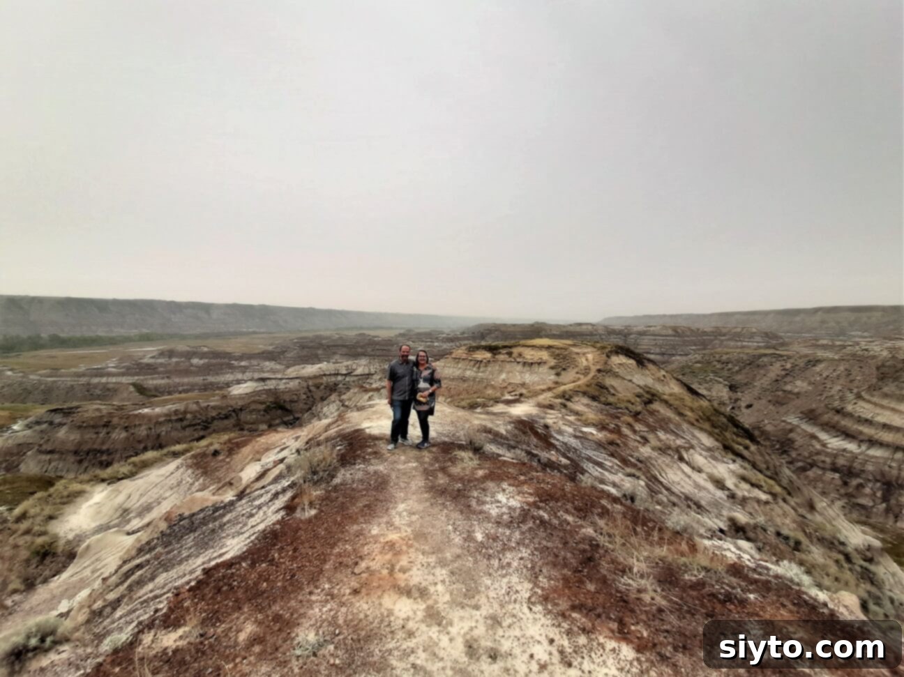 The author and Raymond standing together amidst the unique, eroded landscape of Horsethief Canyon, taking in the grand vista.