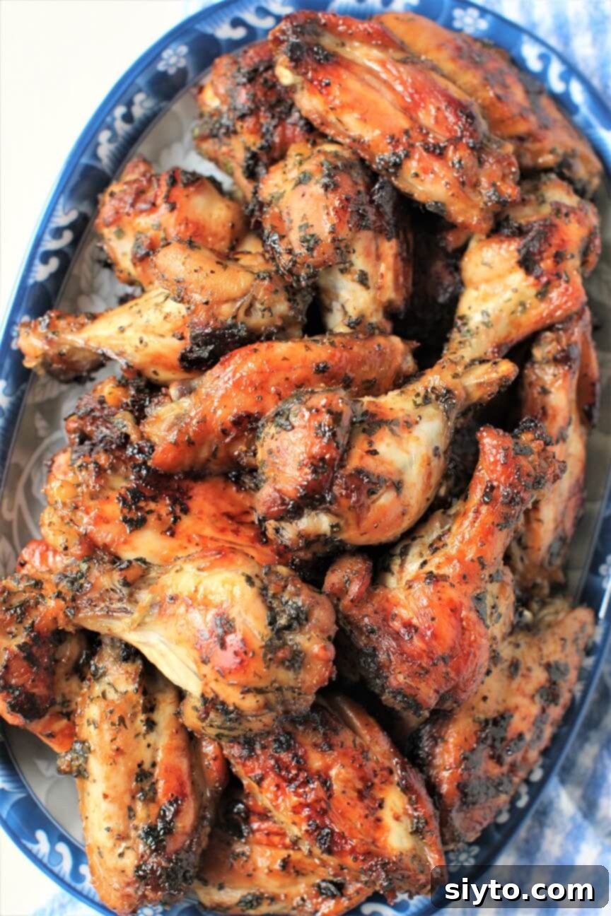 blue platter piled with lao grilled chicken wings