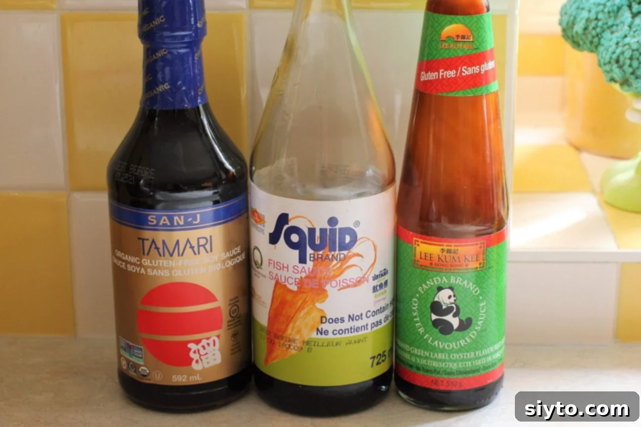 a bottle of tamari, one of fish sauce, and one of gluten free oyster sauce