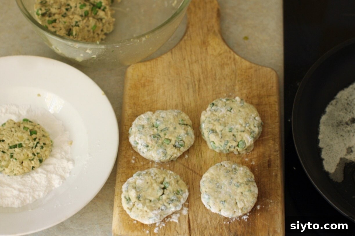 A neat station set up for rolling and coating puffball patties with flour before frying.
