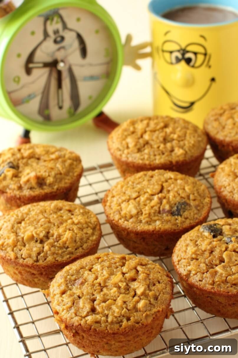 Handheld Harvest Pumpkin Oatmeal Muffins 3 rack of pumpkin baked-oatmeal muffins cooling