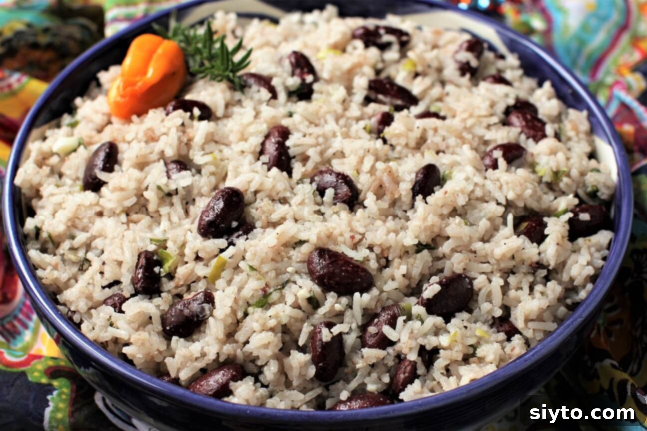 A beautifully presented bowl of Jamaican Rice and Peas, captured in a horizontal view, ready to be served.