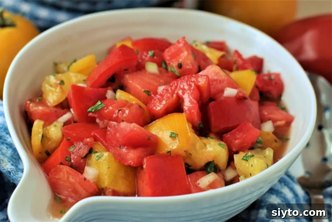 Classic German Tomato Salad 8 A vibrant bowl of simple red and yellow tomatoes cut into a German-style salad