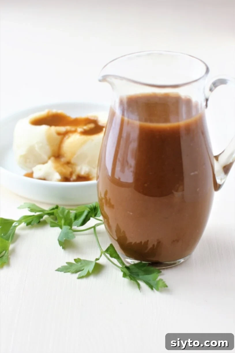 Pitcher filled with smooth, golden gluten-free turkey gravy, ready to serve