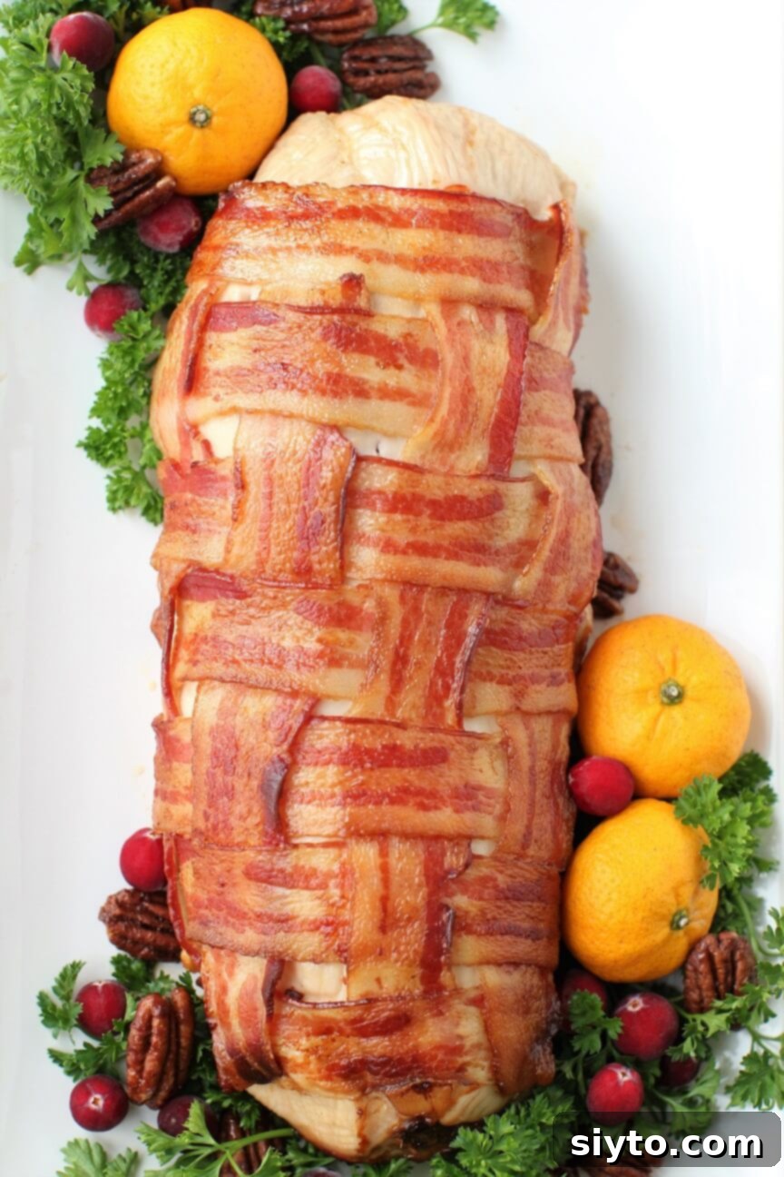 Savory Bacon Wrapped Stuffed Turkey Breast 14 Bacon wrapped roll out of the oven and decorated for serving