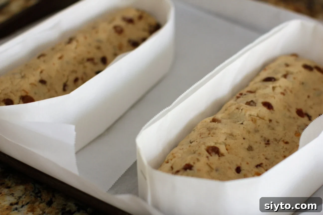 Quarkstollen: The Quicker German Christmas Cake 16 parchment bands around the cakes pushed down to rest on the pan