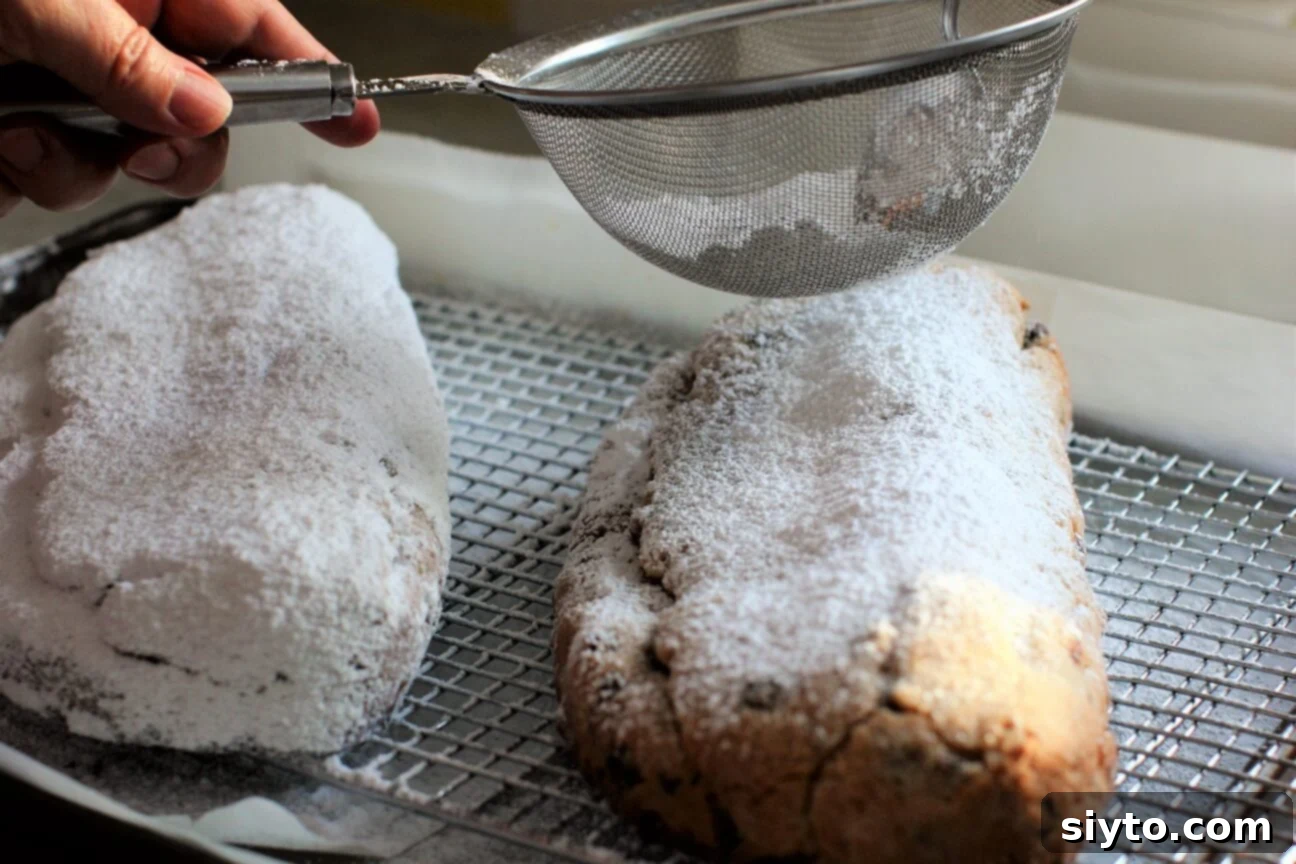Quarkstollen: The Quicker German Christmas Cake 20 sprinkling icing sugar through a sieve onto the cakes
