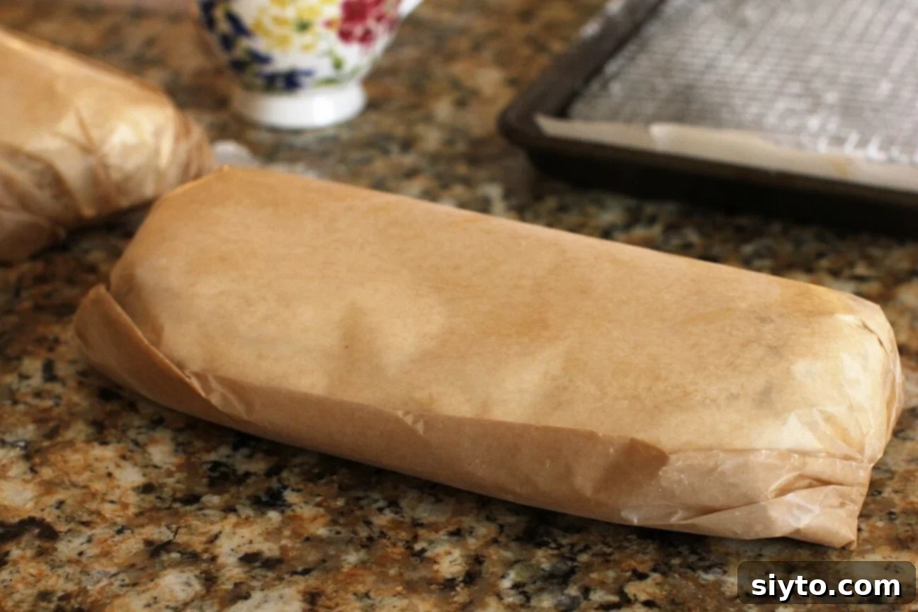 Quarkstollen: The Quicker German Christmas Cake 21 Stollen wrapped in parchment paper