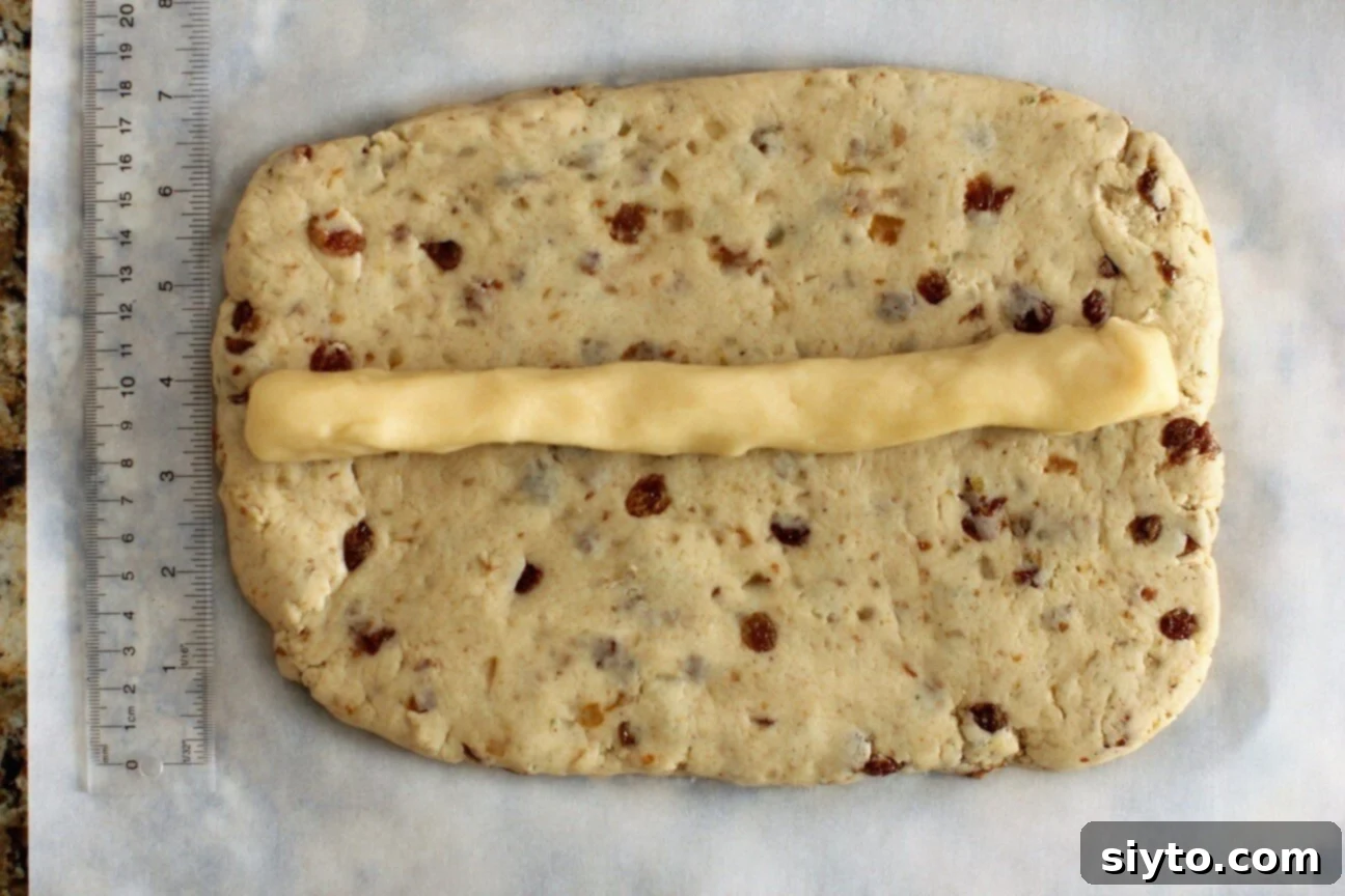 Quarkstollen: The Quicker German Christmas Cake 10 marzipan rope layed out on the dough rectangle