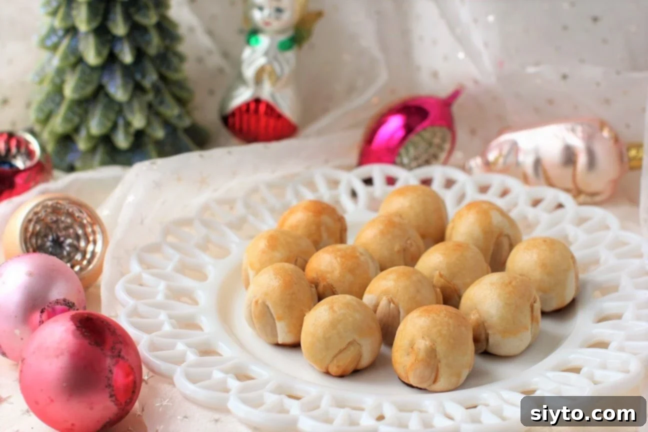 marzipan cookies on a plate, with Christmas balls around
