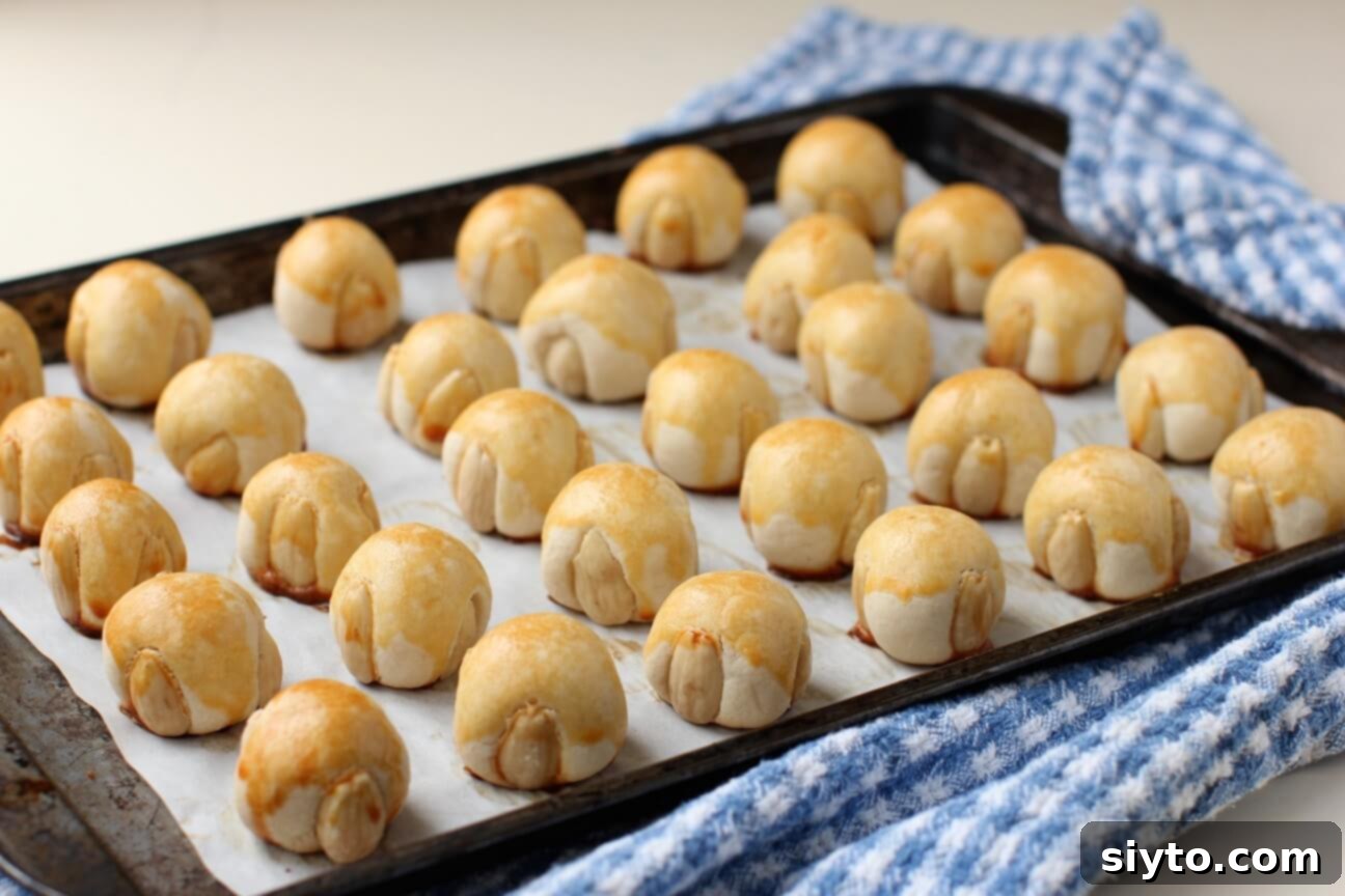 a pan of baked marzipan cookies cooling