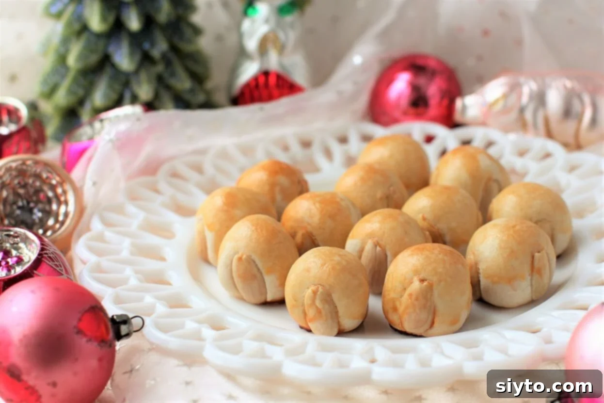 horizontal view, Bethmännchen on a plate with pink Christmas ornaments around