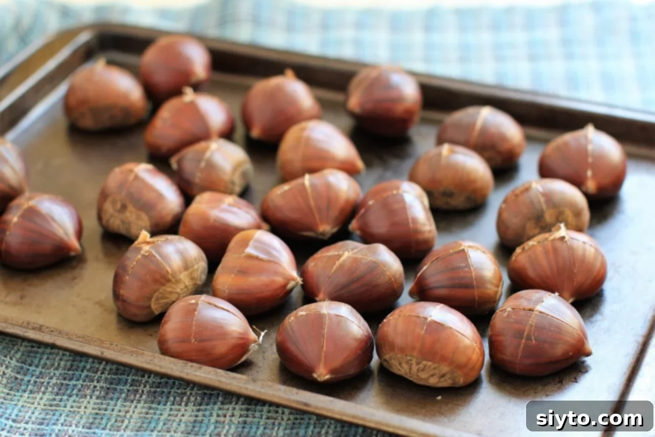 single layer of chestnuts on a baking sheet