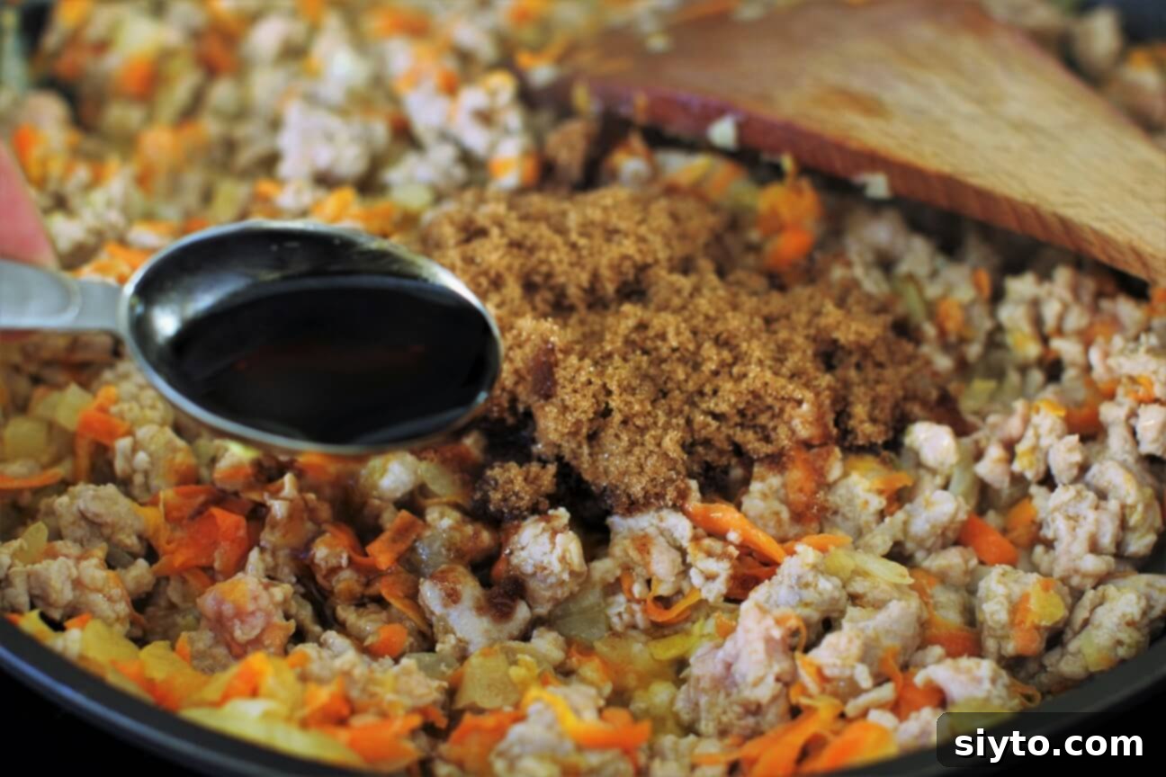Adding brown sugar and fish sauce to the caramelizing pork, creating the signature Vietnamese flavor