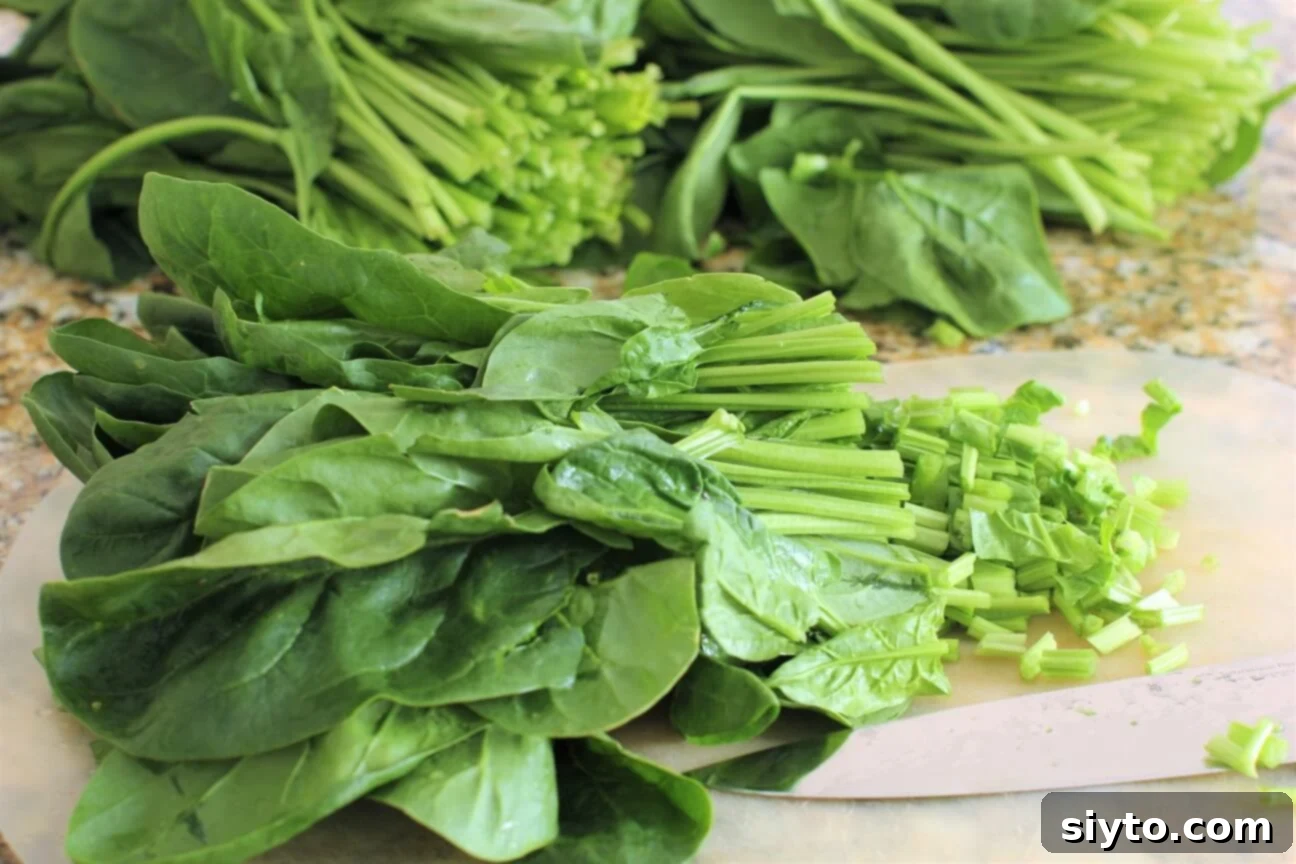 chopping fresh spinach for the Sudanese creamed spinach dish, highlighting fresh ingredients