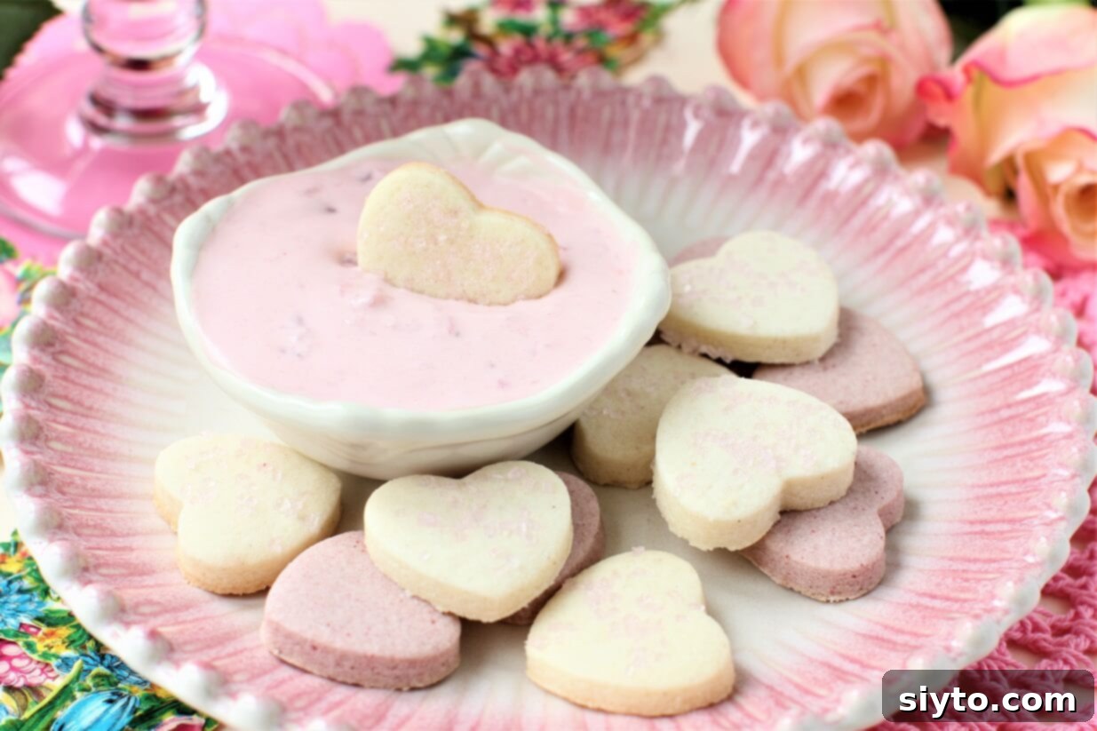 pink plate with heart shaped butter roll cookies in pink and white