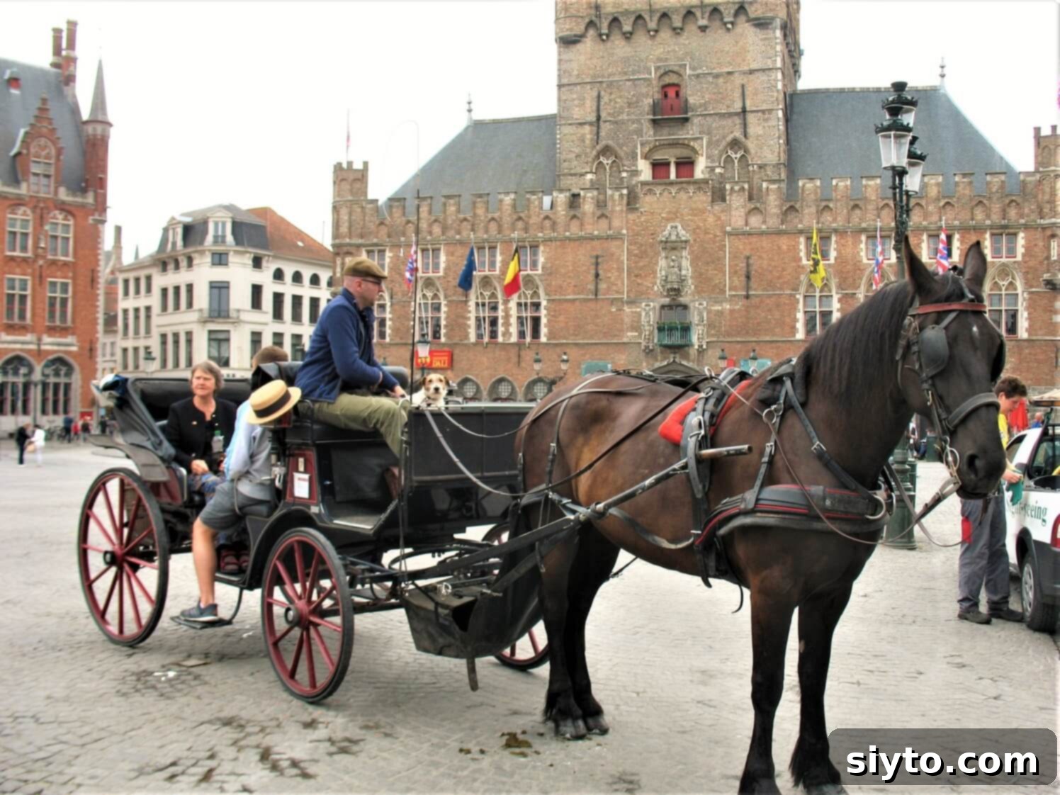 Chicons au Gratin: A Taste of Our Belgian Journey 7 A charming scene of a family sitting in a horse-drawn carriage in Bruges, enjoying a scenic city tour