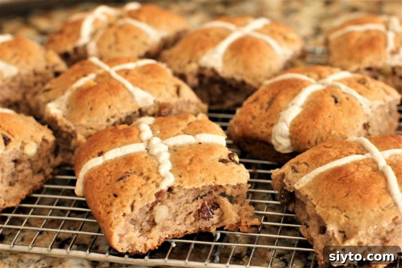Fluffy Gluten-Free Hot Cross Buns 3 Freshly baked gluten-free hot cross buns cooling on a wire rack, still warm and inviting