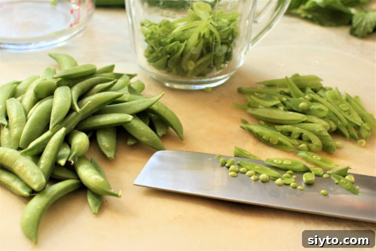 Snap Pea and Radish Salad: A Taste of Spring 8 Hands demonstrating how to cut sugar snap peas at a steep diagonal angle to create long, thin shreds for the salad.