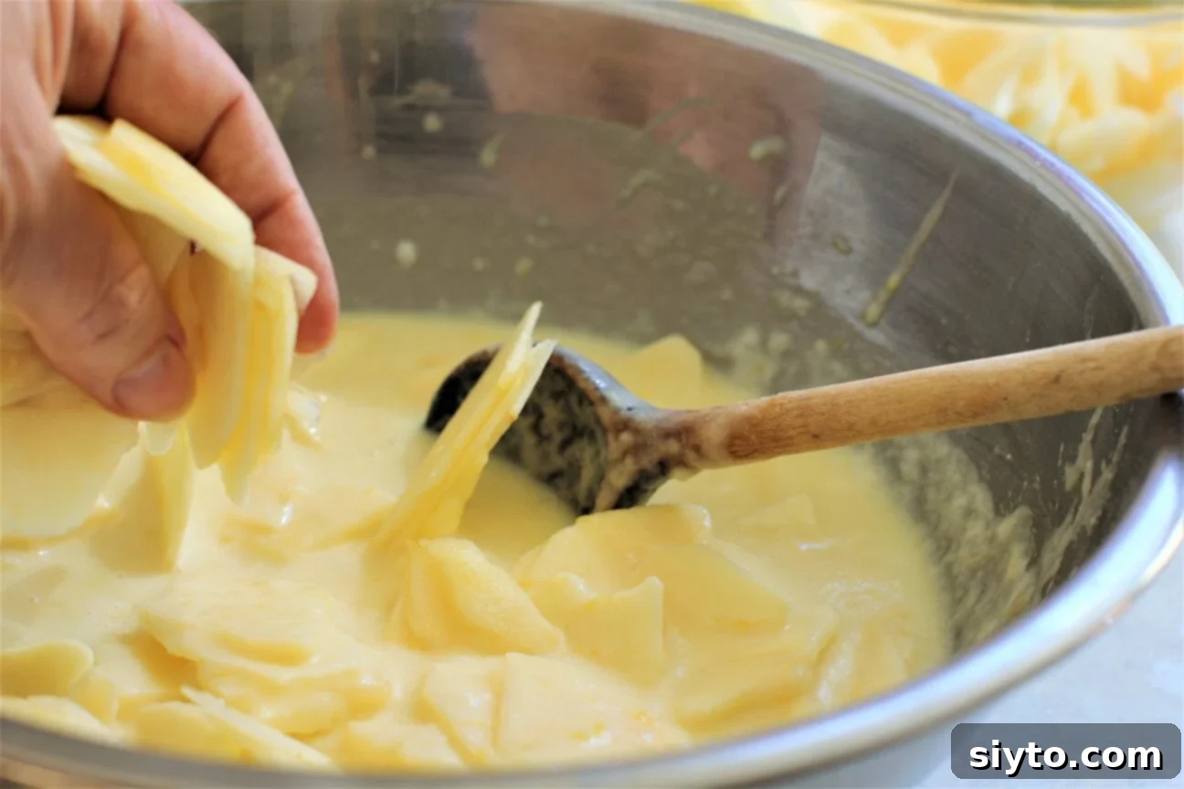 German Crustless Apple Pie: Creamy and Bursting with Apples 9 folding the apple slices into the batter