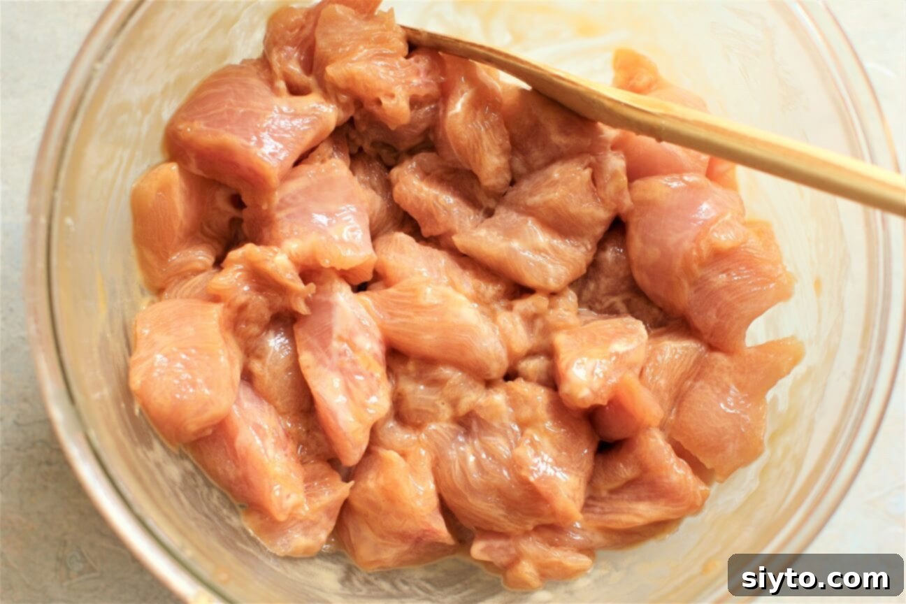 marinating the meat chunks in soy and cornstarch