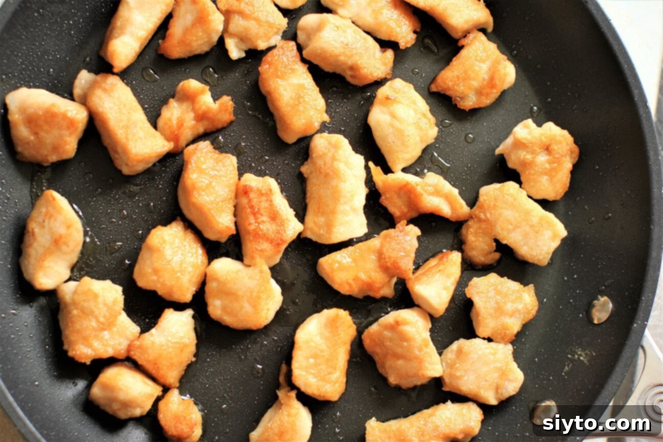 pan-frying the meat chunks until crispy and golden