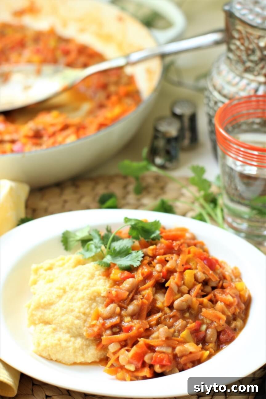 Chakalaka & Pap: Lesotho's Soul Food 2 Chakalaka with Pap, a traditional Lesotho vegetable and bean stew, served on a white plate ready to eat.