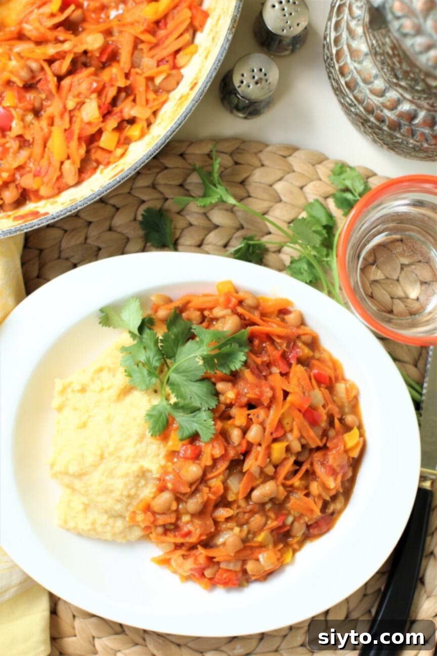 Chakalaka & Pap: Lesotho's Soul Food 6 Top-down view of a complete Chakalaka dinner, beautifully presented with a side of creamy Pap on a rustic table setting.