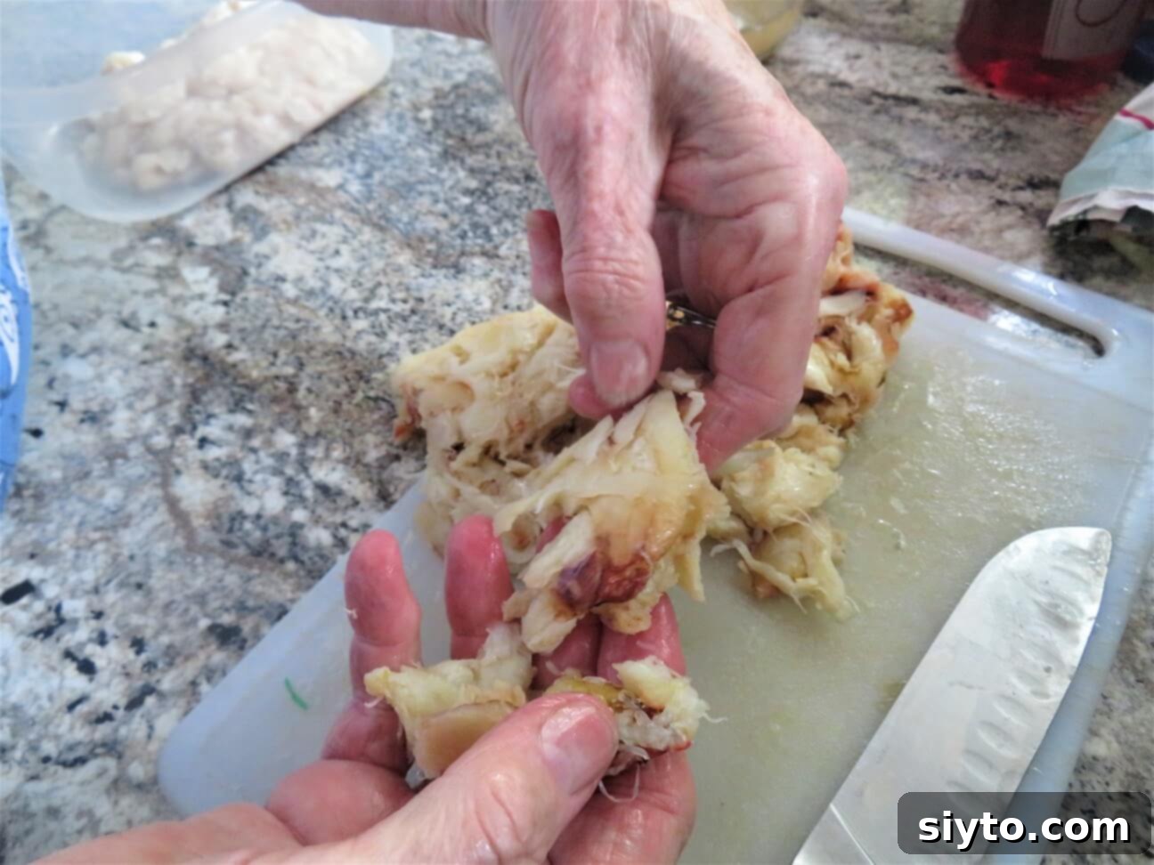 cutting up the crab meat