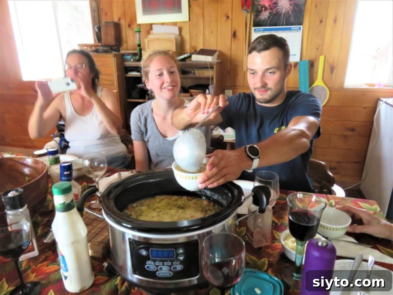 Clay ladling a bowl of chowder