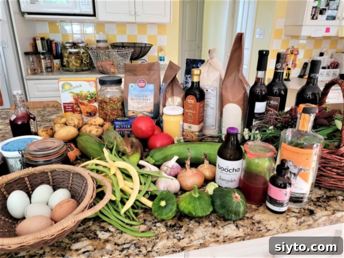 All the local Alberta ingredients laid out on a kitchen counter, including steak, produce, and spirits