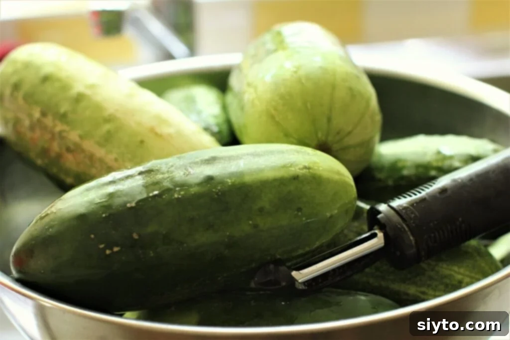 A bowl filled with large, overripe cucumbers