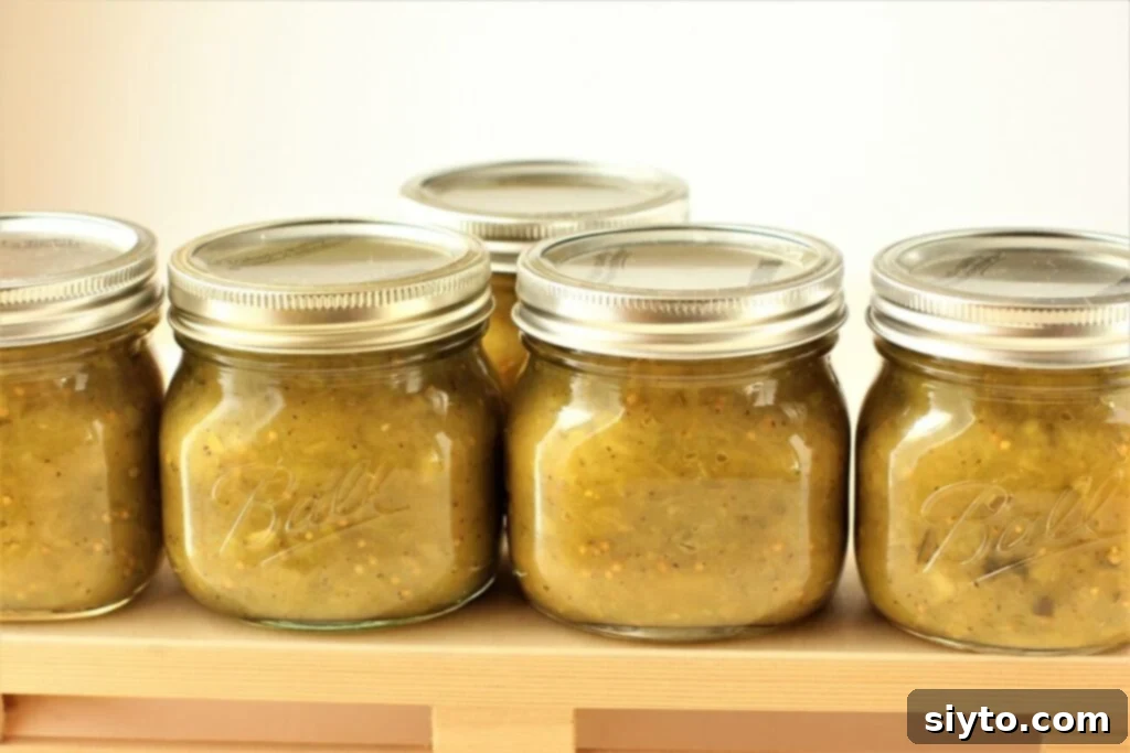 Neatly lined up jars of homemade relish