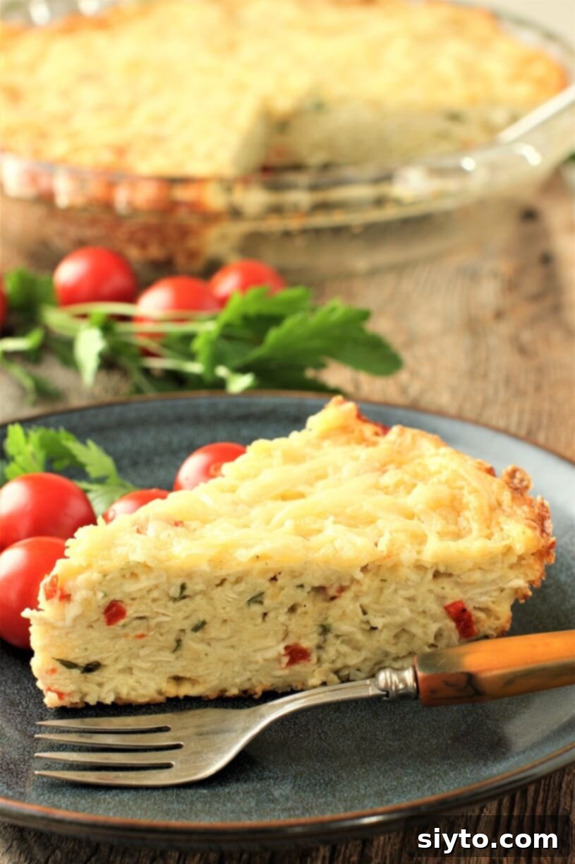 A perfectly sliced piece of golden-brown crustless puffball pie on a white plate, with the rest of the pie in a dish blurred in the background, showcasing its creamy interior.