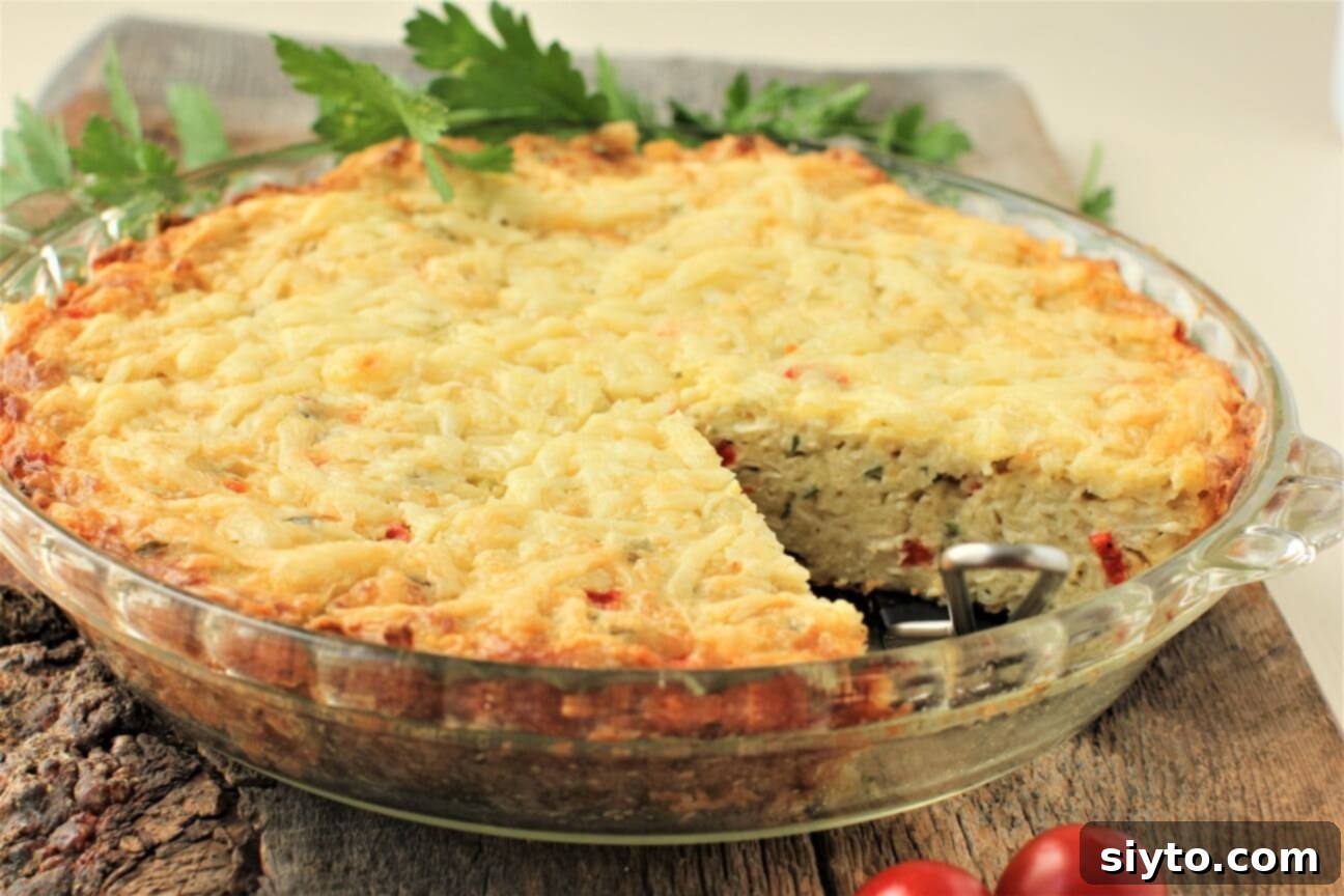 A baked crustless puffball pie in a ceramic dish, with one slice carefully removed, revealing its creamy, light interior and golden-brown top.