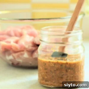 jar of souvlaki marinade and bowl of meat